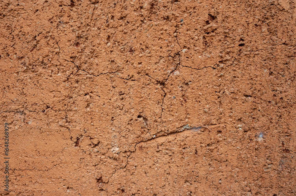 Full frame shot of an earthen wall texture of clay house structure. Full frame shot of an earthen wall texture of clay house structure.