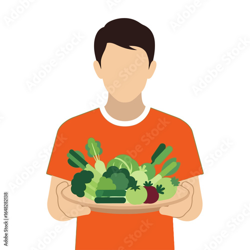 A faceless man wearing an orange t-shirt holds a plate overflowing with fresh green vegetables.