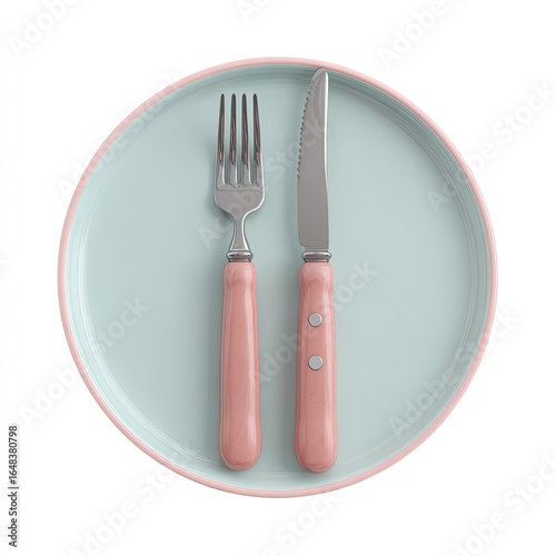 A light-mint-colored plate with a salmon-pink rim holds a fork and knife