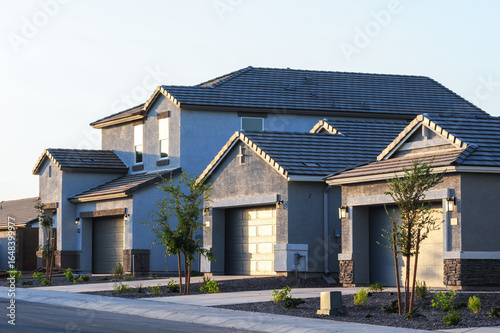 Photography Newly built single-family homes with attached garages, fresh paint, and minimal