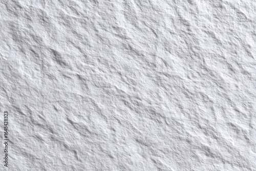 Close-up view of a textured, light gray stone surface