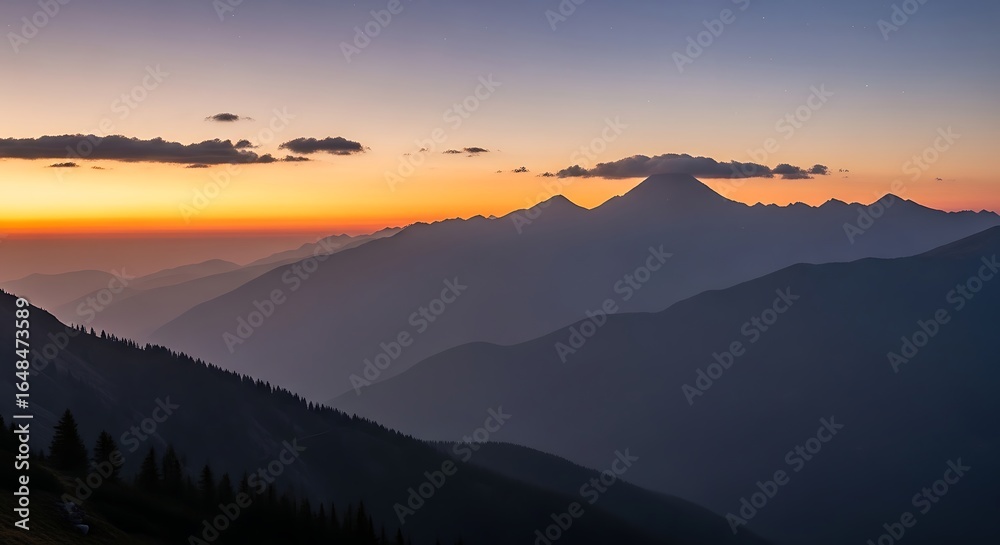 Fototapeta premium Majestic layered mountain range silhouette at dusk with ethereal orange and purple sky backdrop