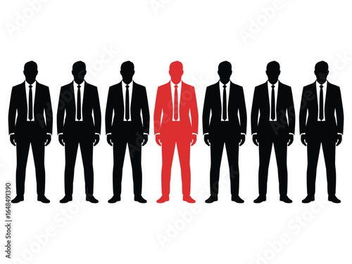 A striking red suited man prominently stands out in a line of black identical figures