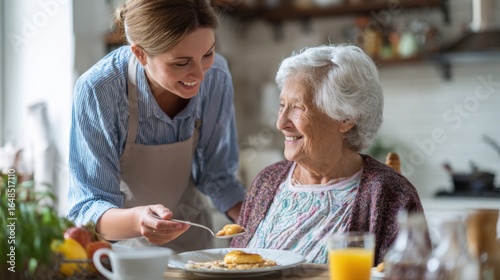 Caregiver Assisting Elderly Woman with Breakfast in Bright Kitchen