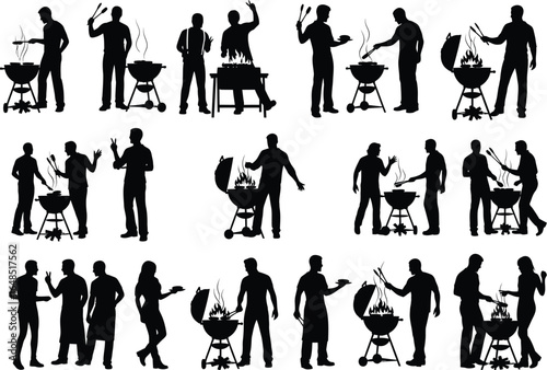 Silhouettes of people enjoying a summer barbecue with grills and food preparation in a casual outdoor setting