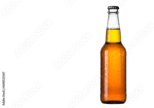 Close-up of an amber-colored glass beer bottle illuminated against a black background