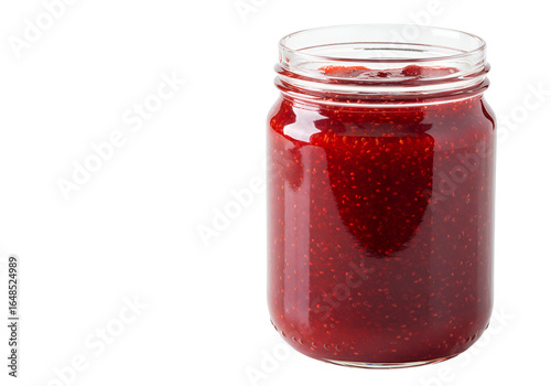 Close-up of fresh strawberry jam inside a clear glass jar with a black background