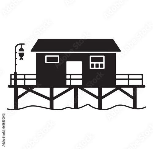 Black and white illustration of a wooden coastal house on stilts by the water