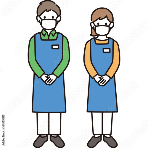 Two people wearing face masks and aprons standing in a greeting pose