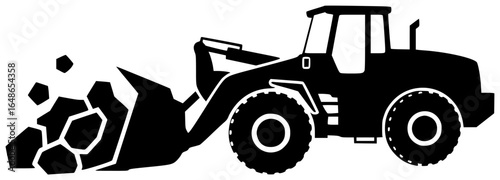 Loader moving heavy cargo and loading large rocks with massive machines underground