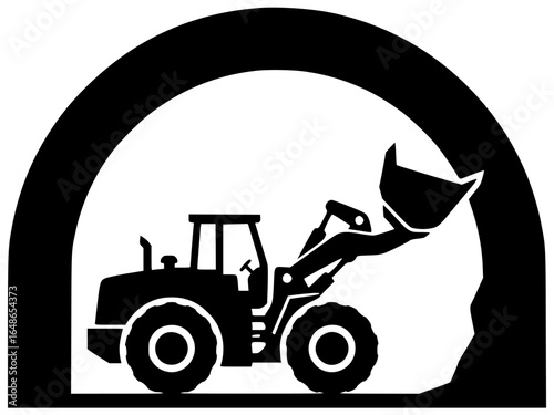 Loader moving heavy cargo and loading large rocks with massive machines underground