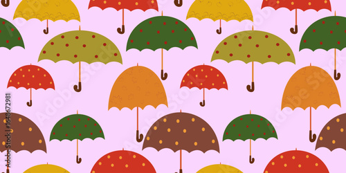Seamless pattern of assorted cartoon autumn umbrellas in warm colors with various patterns, scattered on a light pink background. Ideal for children fall themes.