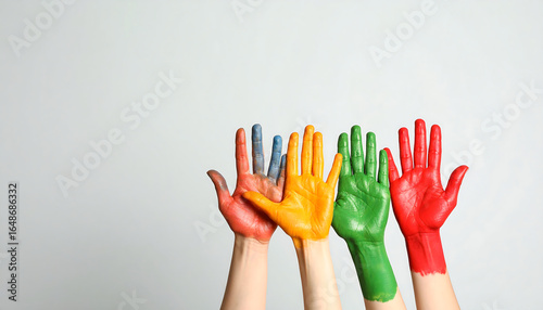 Group of Raised Hands Painted in Bright Colors for Creativity Diversity and Teamwork Concept