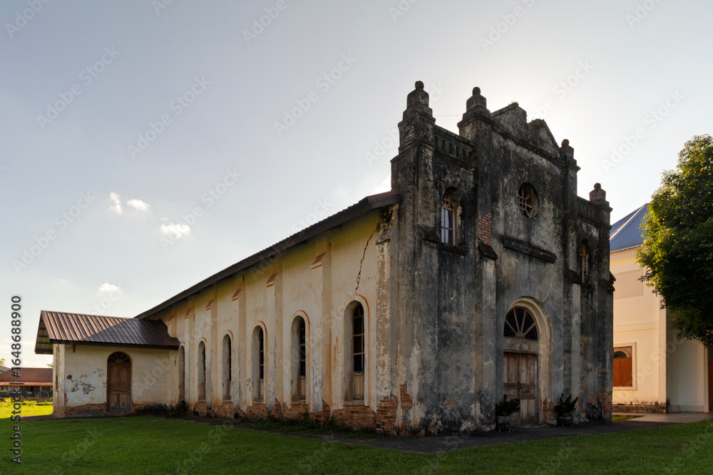 Fototapeta premium Historic Saint Joseph Church in Ban Kham Khem, Nakhon Phanom, Thailand. Beautiful old architecture, used as a filming location for the movie