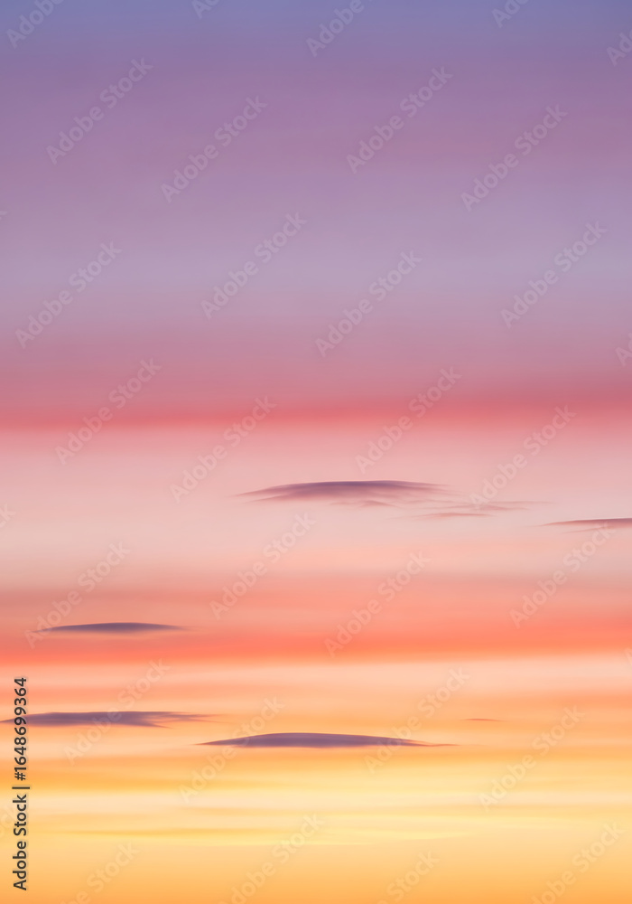 Fototapeta premium Beautiful, dramatic orange and red sunset over the sea with a vibrant cloudscape