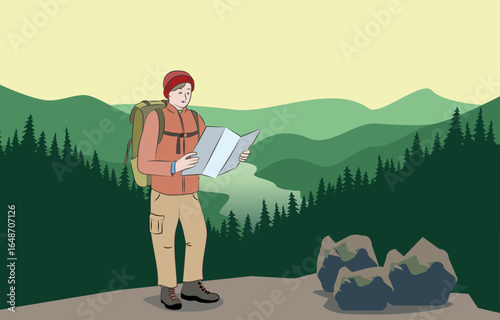 A hiker on a mountain top looking for new routes on the map.