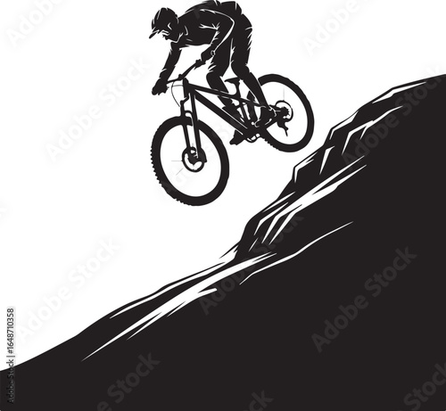 Mountain biker riding down steep hill in extreme silhouette