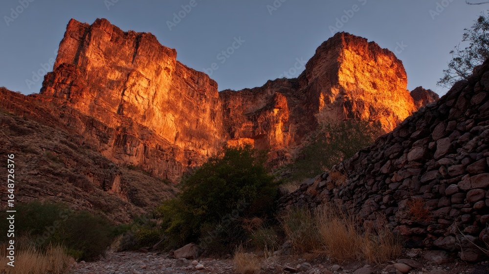Fototapeta premium Canyon walls ablaze at dawn