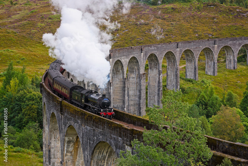 Canvas Print The Jacobite steam train traverses the Glenfinnan Viaduct, offering a stunning view of the Scottish Highlands