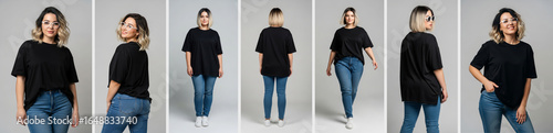 Casual Young Woman in Black Shirt and Blue Jeans Posing on Gray Background