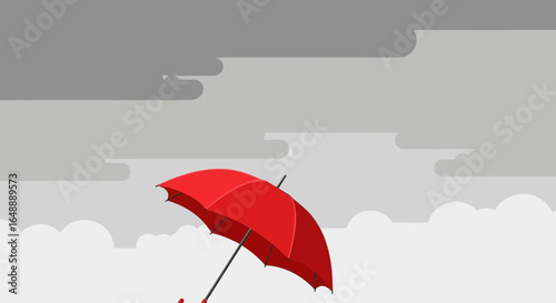 A vibrant red umbrella contrasts with a muted grey sky creating a unique visual narrative drawing attention to the umbrella