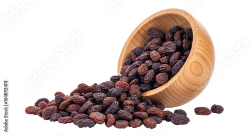 Cuadro en lienzo Isolated raisins spilled from a bowl
