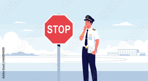Contemplative Aviation Officer Next To Stop Symbol At The Airfield Runway Area