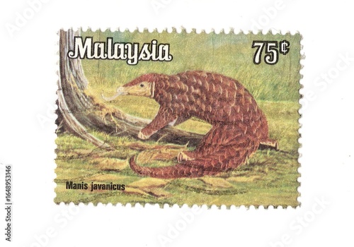 A vintage postage stamp from Malaysia isolated on a white background.