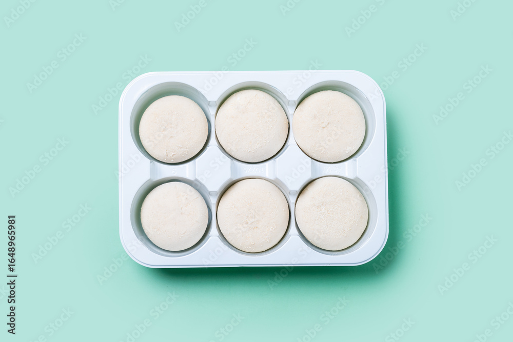 coconut ice cream mochi on green background coconut ice cream mochi on green background