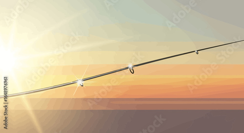Fishing rod against a sunset backdrop creating a peaceful outdoor scene