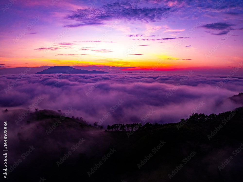 Obraz premium Drone aerial view of landscape mountains view in sunrise or sunset time,High angle view over countryside at northern Vietnam