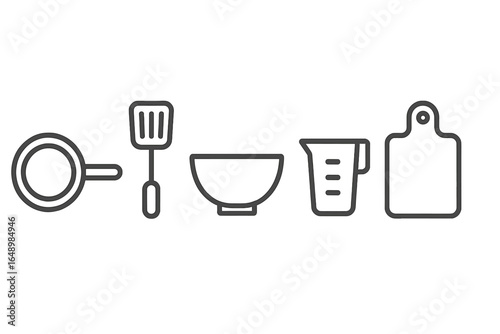 Kitchen utensils lined up ready for cooking preparation in a home setting during daytime