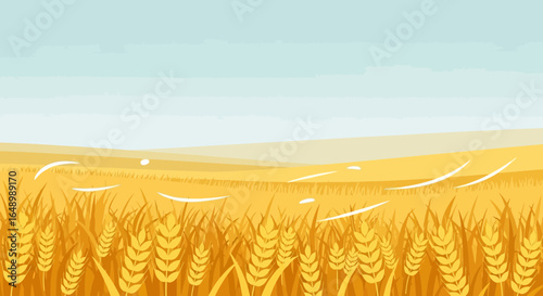 Golden Wheat Field Landscape Against A Pale Blue Sky
