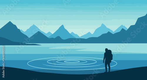 Hiker Silhouette Contemplating Mountain Landscape Reflecting In Serene Blue Waters