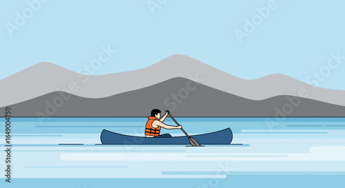 Man Paddling In A Canoe During A Vacation On A Peaceful Mountain Lake