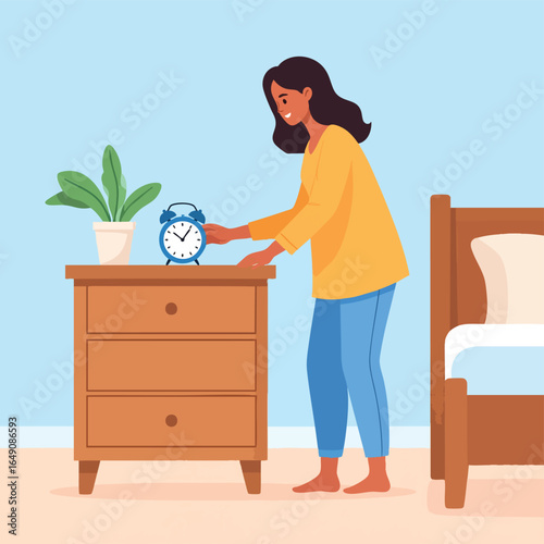 A woman waking up, reaching for and setting an alarm clock on a bedside table in a bedroom.