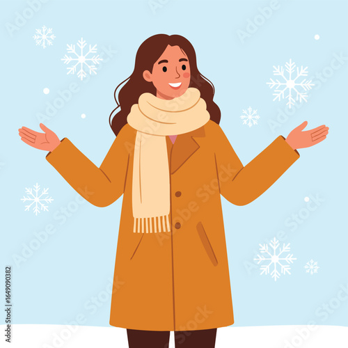 Happy woman in winter coat enjoying snowfall.
