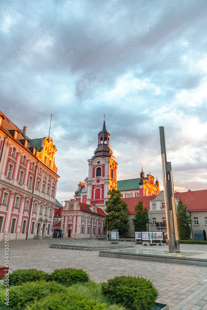 Fototapeta premium Kolegiac Square in Poznan at sunset in spring in Poland