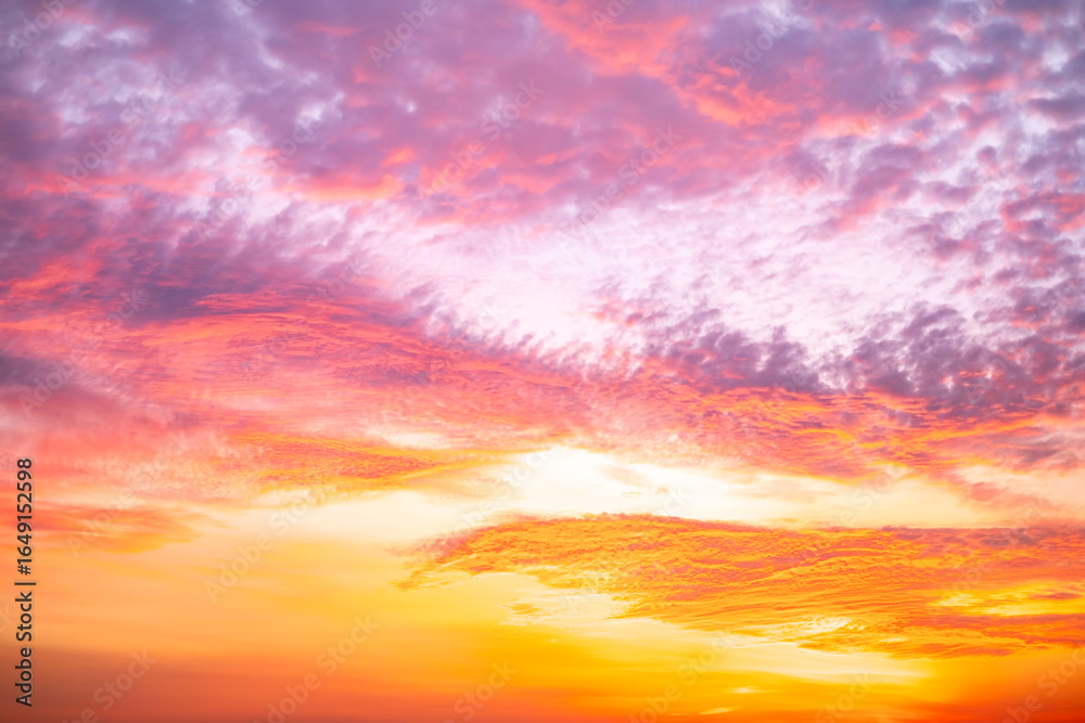 Obraz premium Beautiful , luxury soft gradient orange gold clouds and sunlight on the blue sky perfect for the background, take in evening,Twilight, Large size, high definition landscape photo
