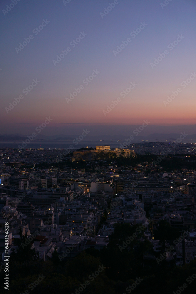 A beautiful twilight view of Athens showcasing the iconic Acropolis skyline is mesmerizing A beautiful twilight view of Athens showcasing the iconic Acropolis skyline is mesmerizing