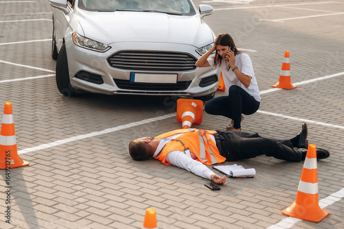 Calling the ambulance. Horrible crash, woman hit a man that is lying down on the road
