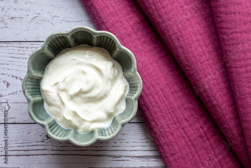 Wallpaper Mural Porcelain green bowl with natural yogurt on the wood table with napkin. Torontodigital.ca
