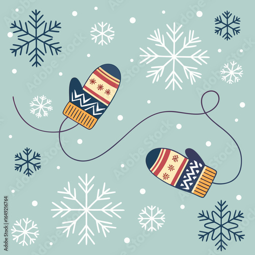Cozy winter mittens and snowflakes on a light blue background