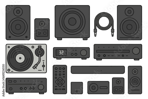 Variety of audio equipment arranged on a flat surface showcasing speakers, turntables, and receivers for sound enthusiasts