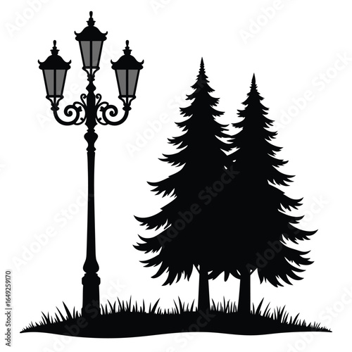 Black silhouette of vintage street lamp and pine trees