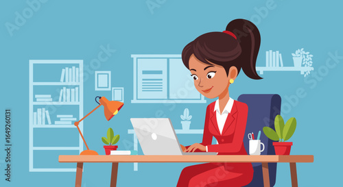 Smiling professional woman in a red suit working diligently on her laptop at an organized office desk, embodying modern productivity and remote work.