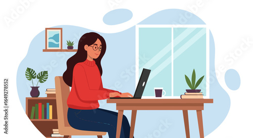 A focused young woman in glasses and a red sweater works on her laptop at a wooden desk, illustrating modern remote work and digital productivity.