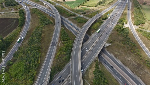 Foto Aerial drone shot of busy motorway junction intersection with numerous bridges a