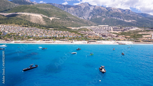 Aerial view of beach clubs along the Himare Albanian Riviera coastline on the Ionian Sea in southern Albania beside vlore.