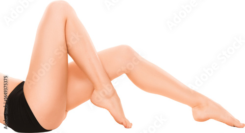 Female legs in black sportswear lying with crossed ankles isolated on transparent. Concept of beauty, body care, elegance, wellness, and fitness with relaxed yet stylish pose.